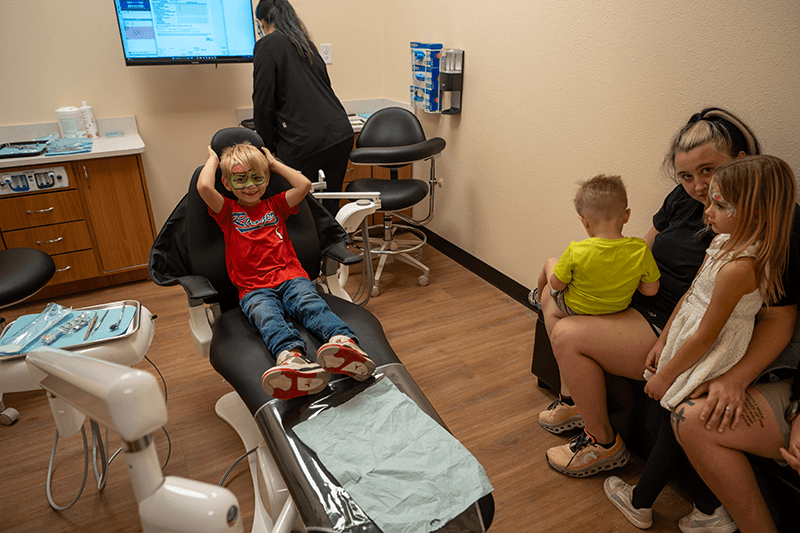 Child with Rodeo Dental team