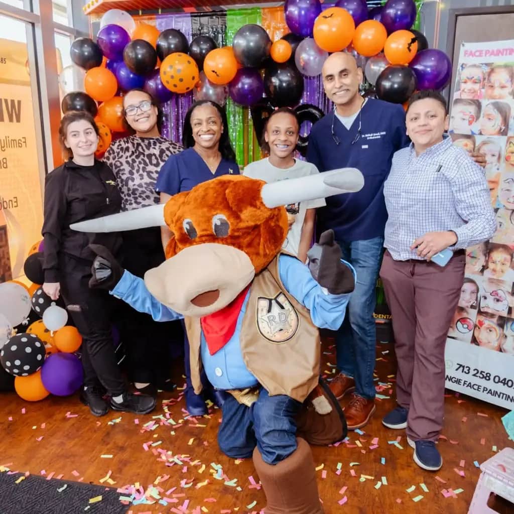 Rodeo Dental team with mascot at Halloween event