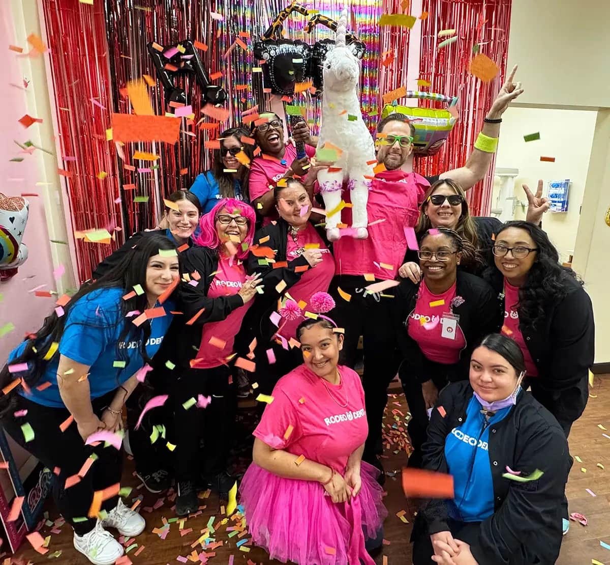 Rodeo Dental team celebrating with confetti