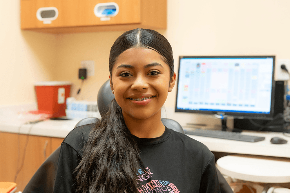 Smiling teen with colorful braces