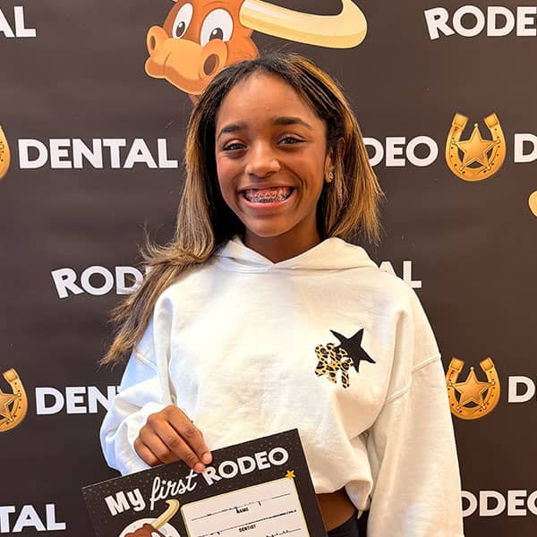Patient smiling after orthodontic treatment at Rodeo Dental
