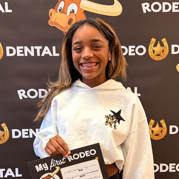 Patient smiling after orthodontic treatment at Rodeo Dental