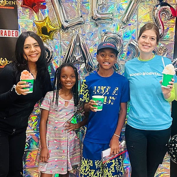 Orthodontist examining teen with braces during checkup