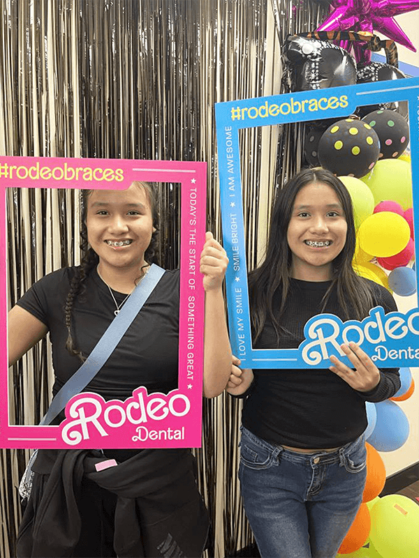 Teen showing off straight teeth after braces removal