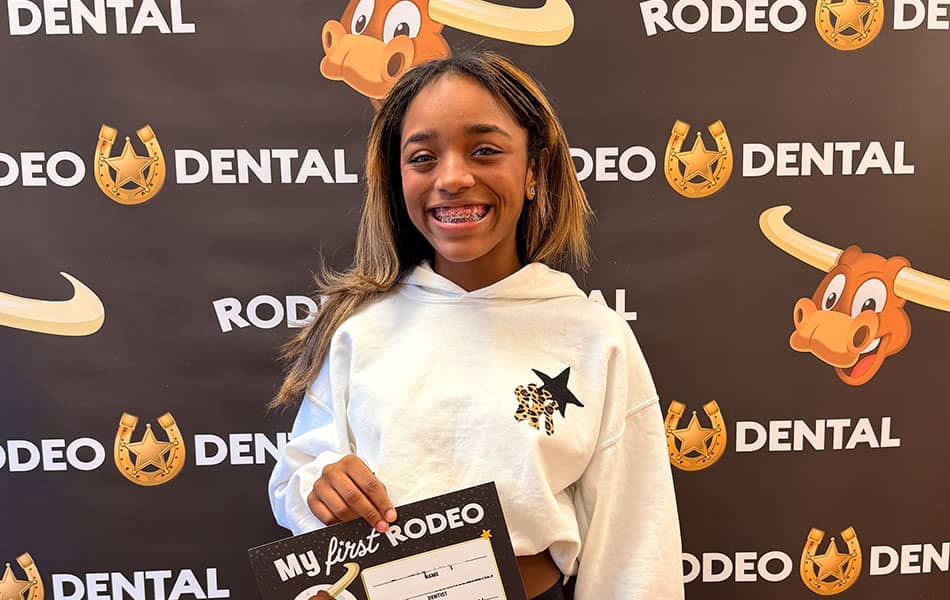 Smiling patient with braces at Rodeo Dental office