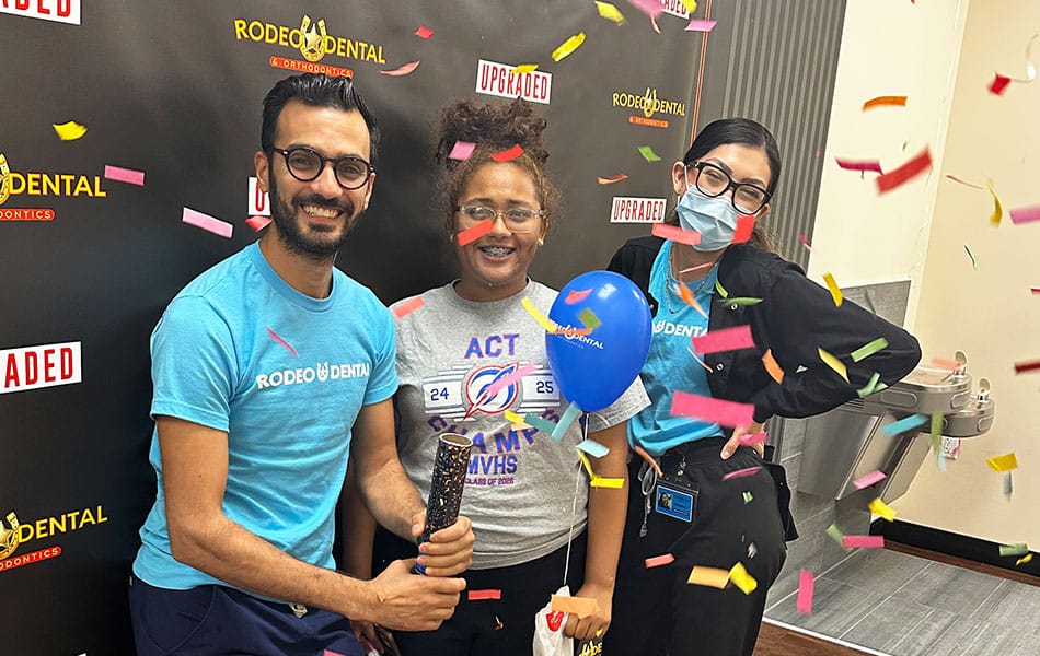 Child getting braces adjusted by Rodeo Dental orthodontist